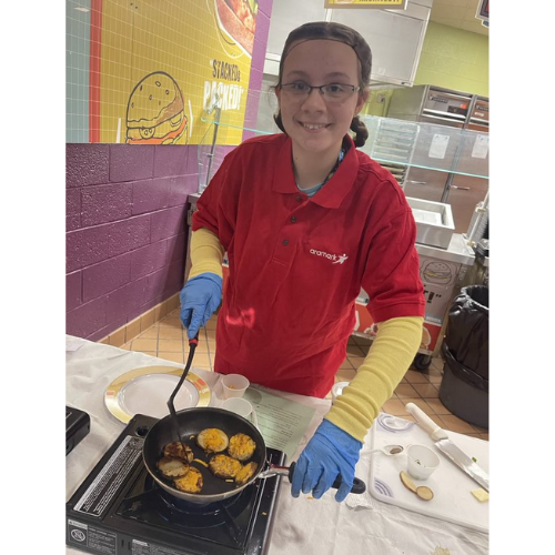 Scranton child smiling and cooking